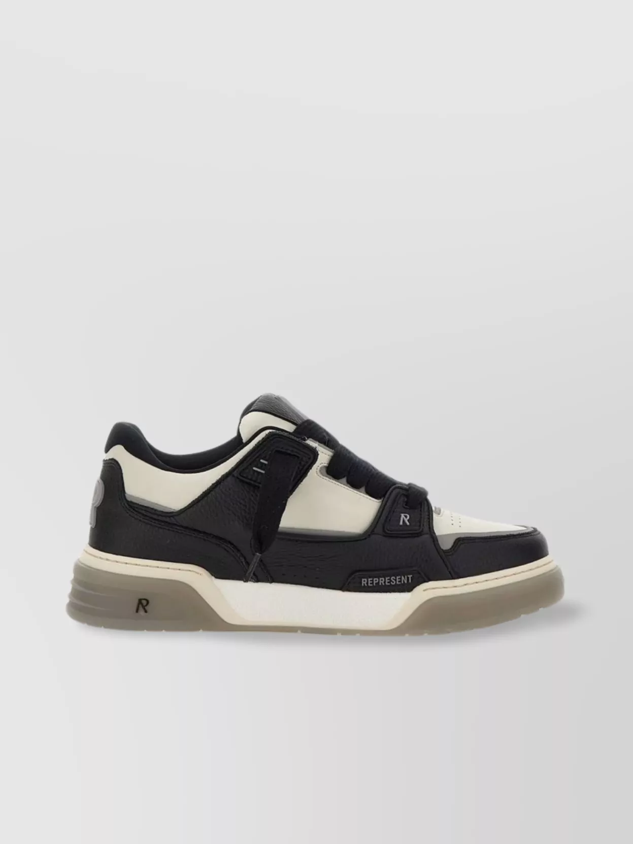 Represent "studio" sneakers tongue elastic gusset — The chunky taupe and cream Represent sneakers sit perfectly with the wide leg and mirror the hoodie’s washed taupe tone, keeping the outfit neutral, modern and street-led.
