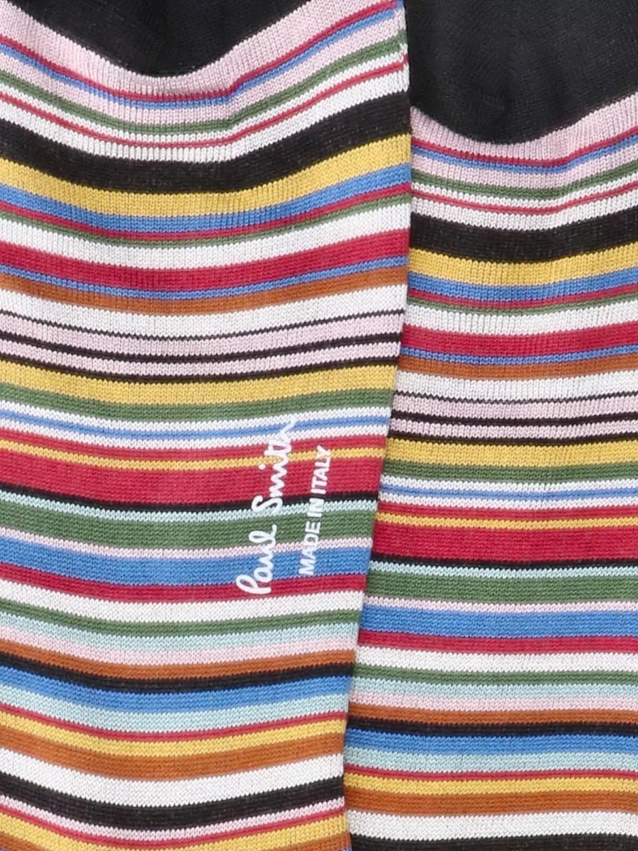 Paul Smith Silk socks — The striped crew socks add a small hit of Paul Smith colour that riffs off both the tee graphic and the sneaker scribbles, tying the whole palette together in a subtle, playful way.