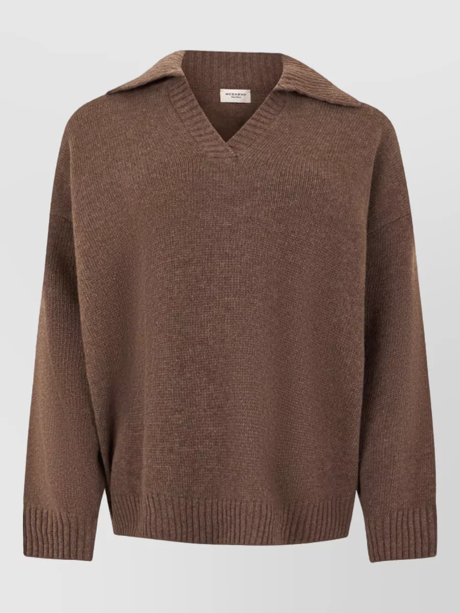 Weekend Max Mara Virgin wool v-neck long-sleeve sweater — The mocha V-neck knit mirrors the jacket’s relaxed, off-duty polish and warm brown palette, giving a soft drape that works perfectly under a cropped, sporty shell.