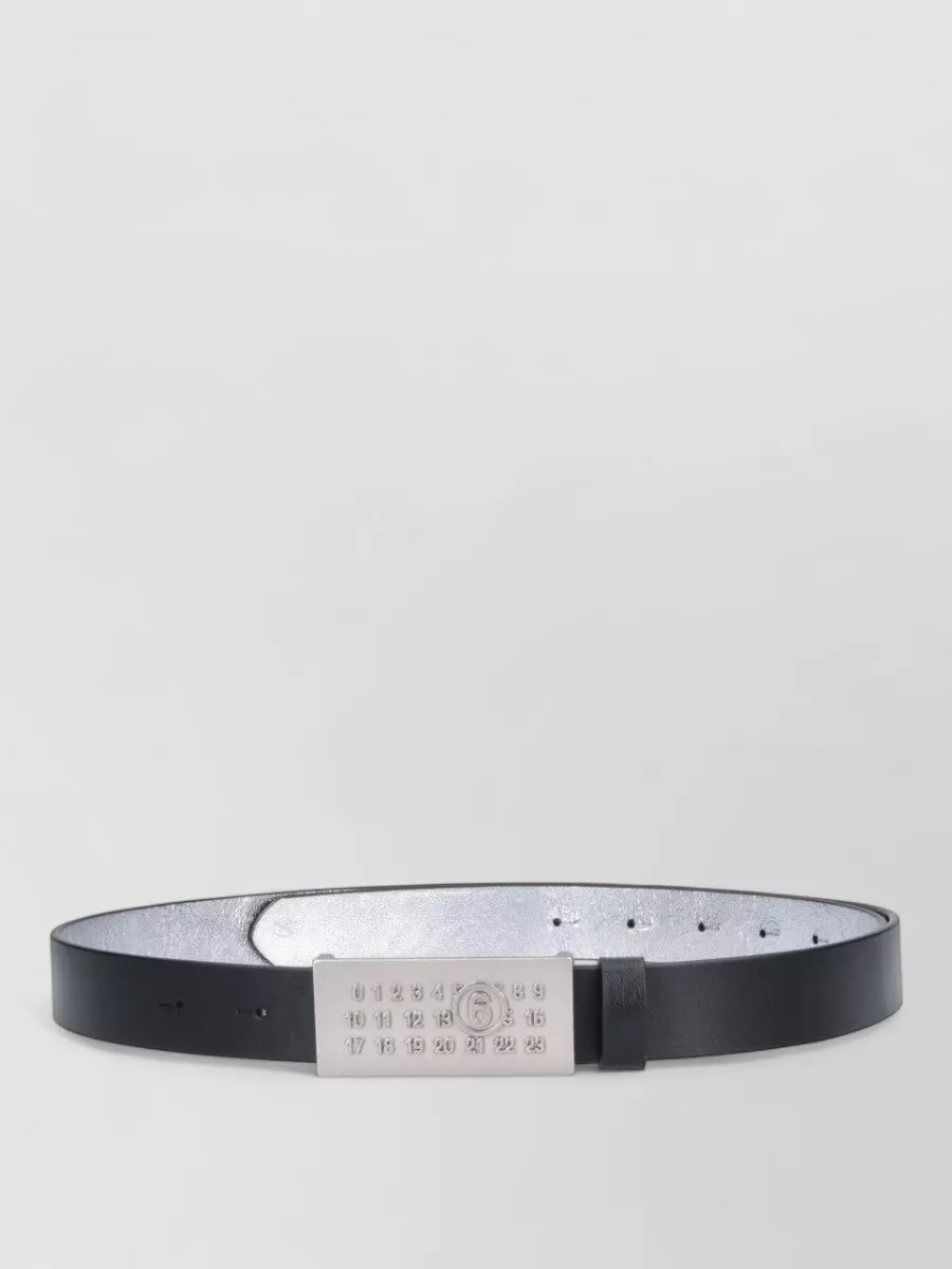 Mm6 Maison Margiela Leather belt — The Mm6 belt quietly sharpens the waist of the wide-leg denim, adding subtle designer hardware without clashing with the Moschino logo story up top.