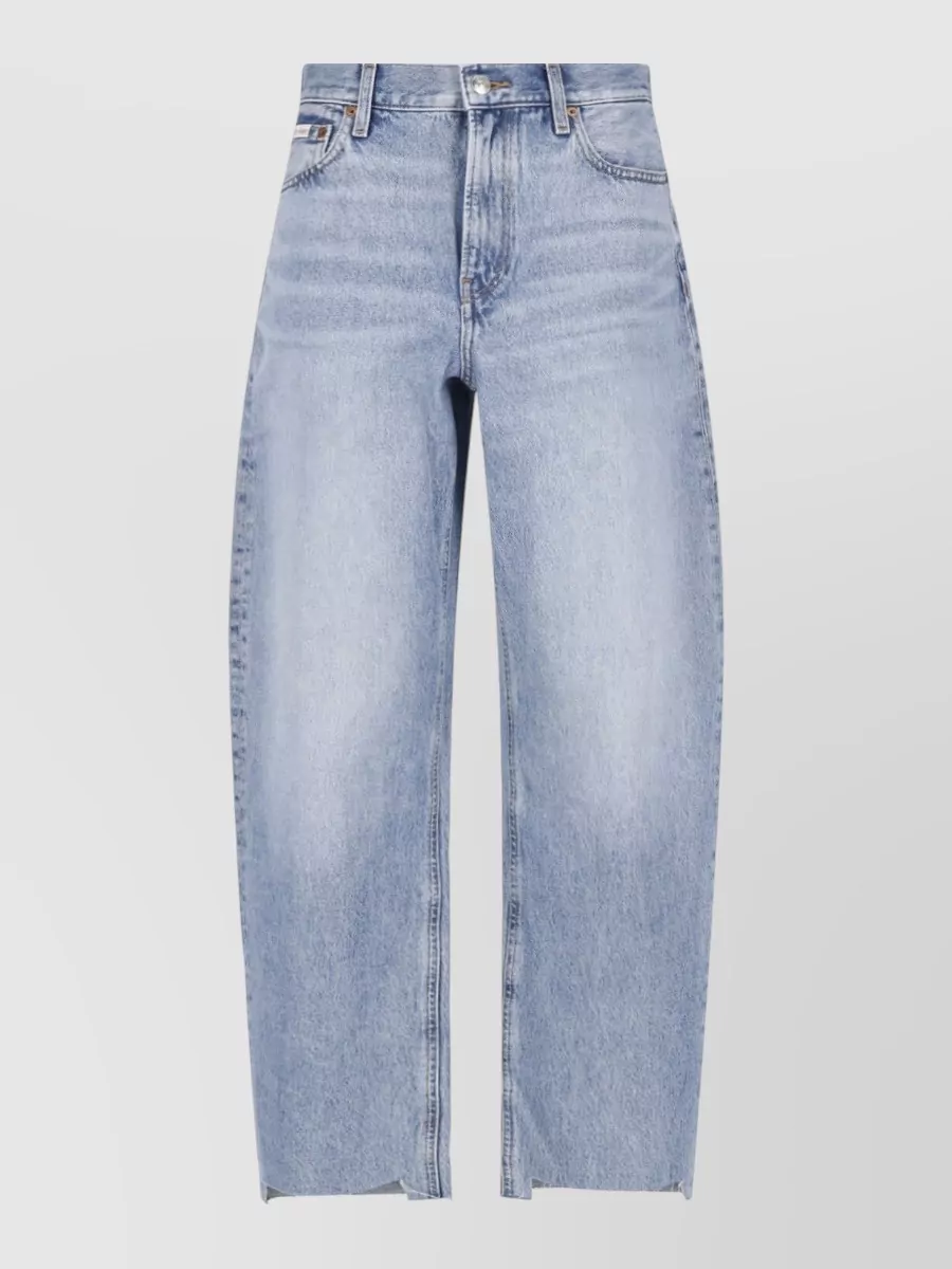 Calvin Klein Straight-leg denim jeans — The high-rise light-wash wide-leg jeans echo the top’s minimalist preppy mood, balance the slim ribbed knit with relaxed volume, and keep the palette softly tonal for casual quiet luxury.