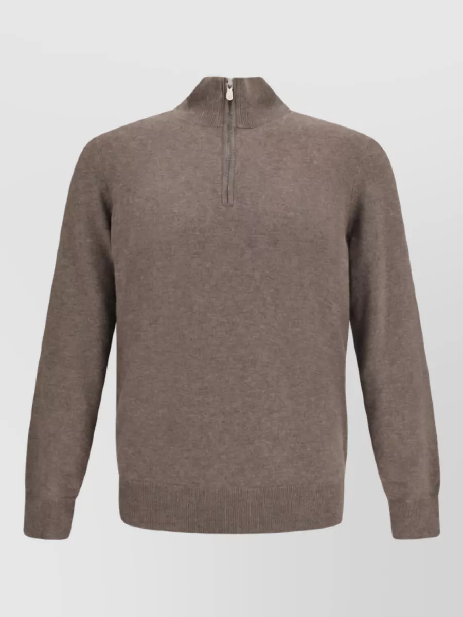 Brunello Cucinelli Cashmere jumper — The warm beige half-zip mirrors the shearling collar and lightens the navy bomber, keeping the mood tailored-casual without competing in structure or weight.
