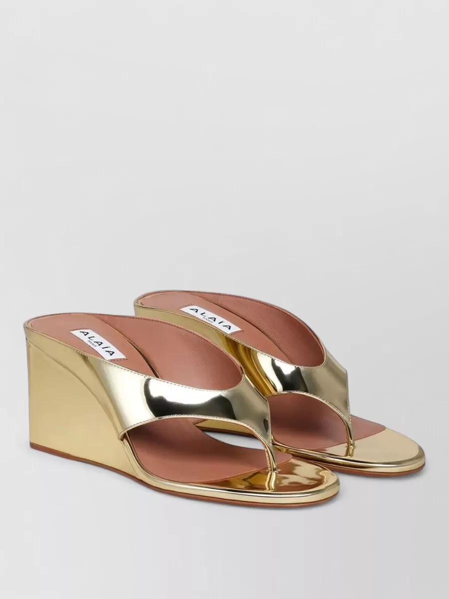 Alaïa mirror wedge thong mules