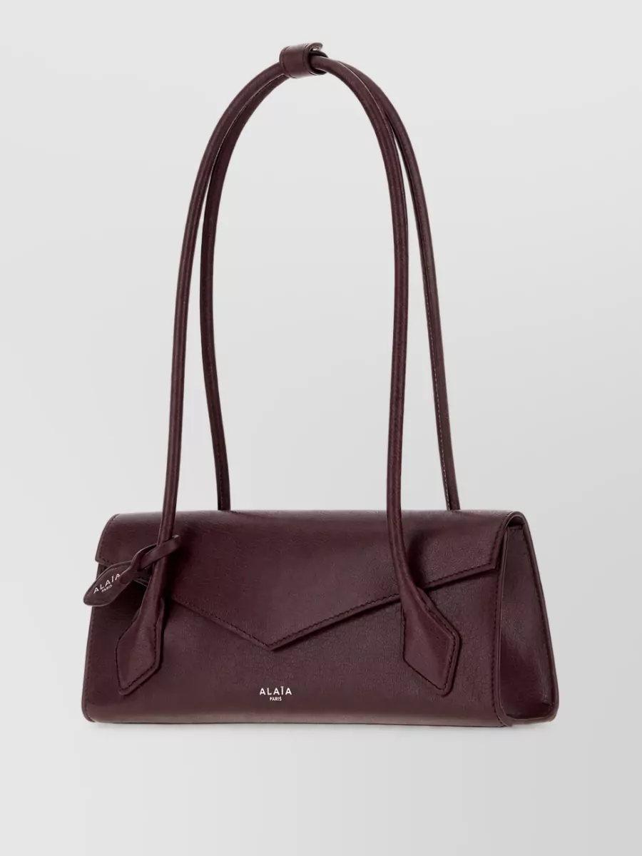 Alaïa leather clutch bag