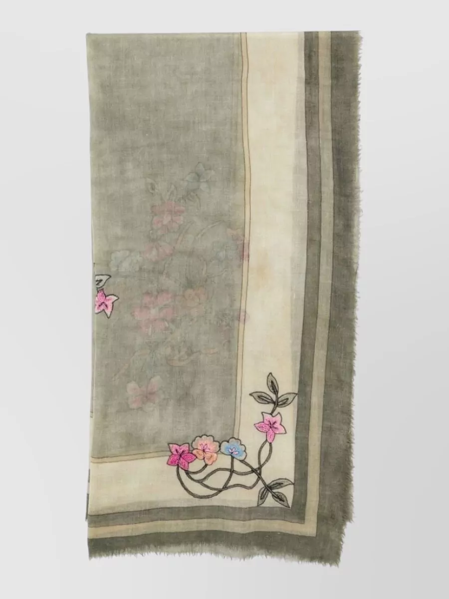 Faliero Sarti Floral-embroidered wool scarf — The Faliero Sarti sage and buttercream stole quietly picks up the skirt’s base tone and adds a soft, romantic layer you can drape over bare shoulders on cooler evenings.