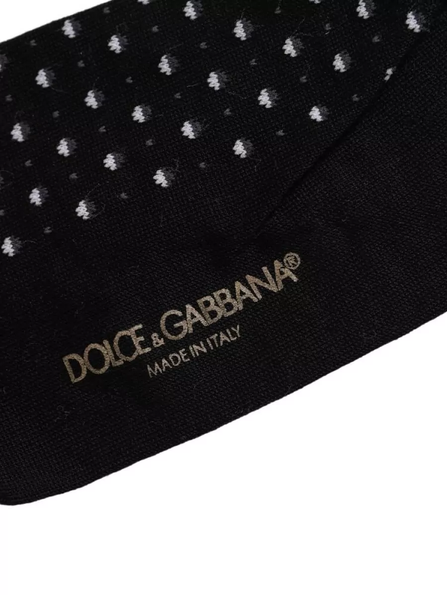 Dolce&Gabbana Polka dot socks — Subtle polka-dot socks echo the shirt in a small, intentional way, tying the outfit together while remaining polished with tailored trousers and loafers.