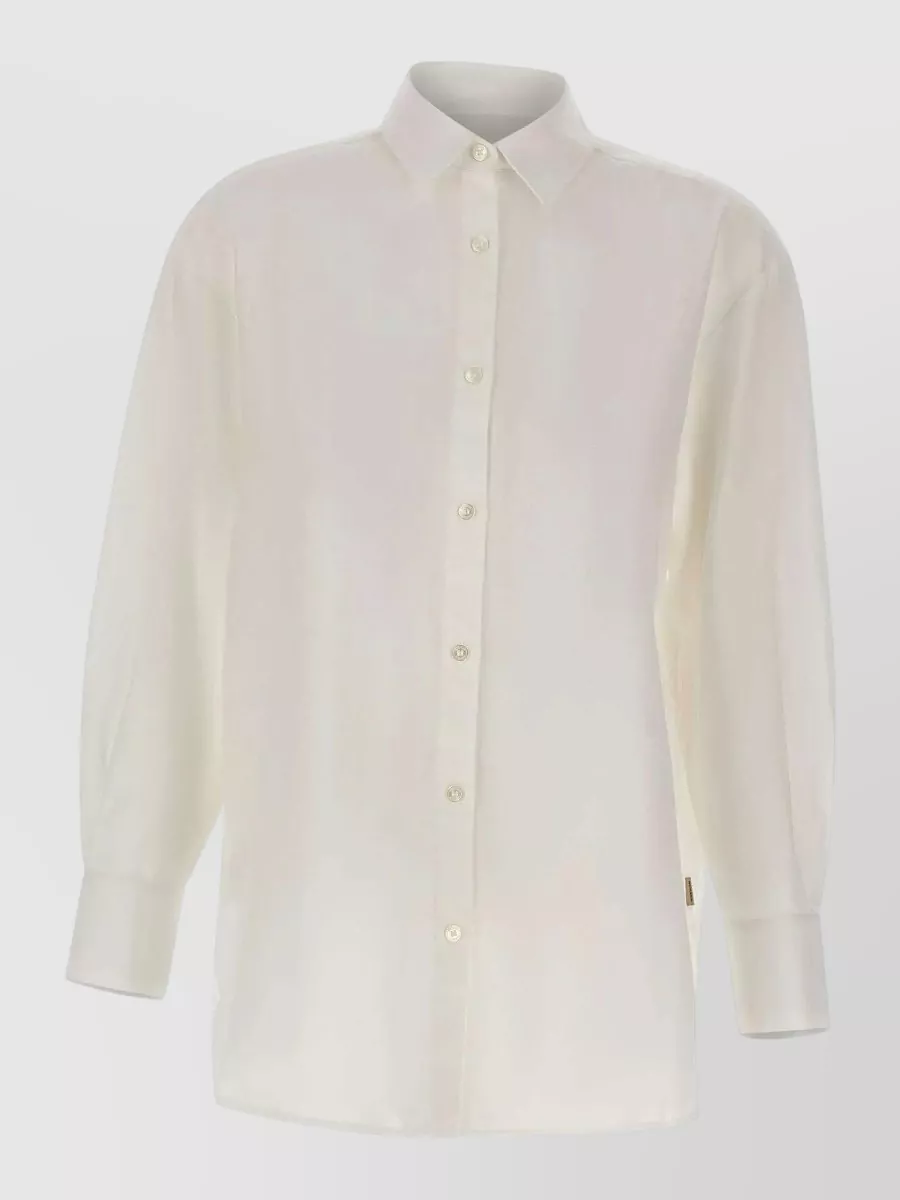 Woolrich Linen boyfriend shirt — The soft ivory longline shirt keeps the outfit quietly tailored and light for warm weather, while its neutral tone flatters the sage utility short without competing with the subtle cargo details.
