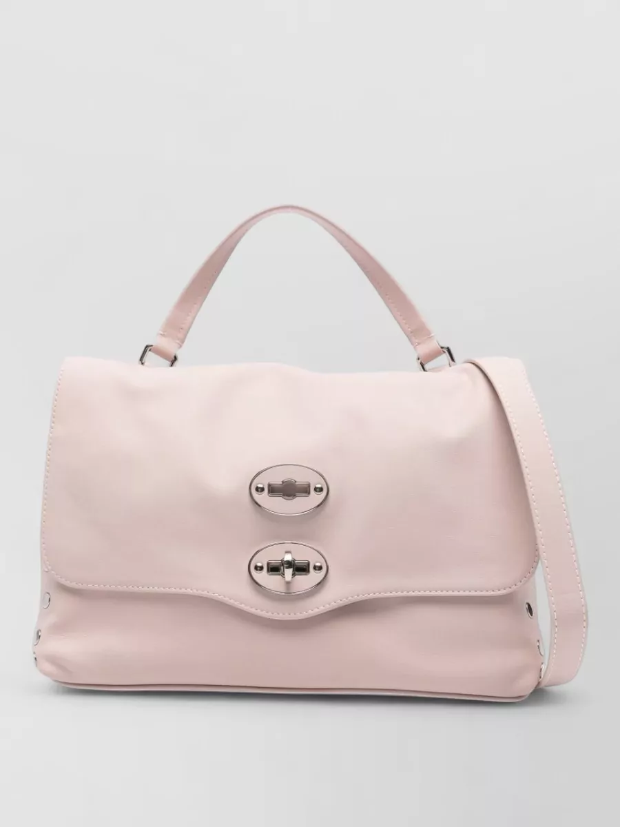 Zanellato Leather studded shoulder bag — The pale blush Zanellato satchel mirrors the trouser colour family without shouting, its structured yet relaxed shape suiting the polished-casual vibe of the denim-inspired pants and tank.