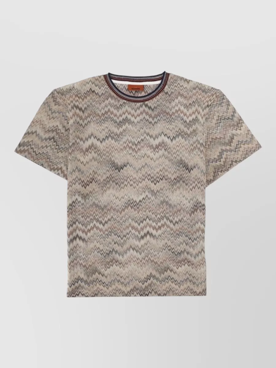 Missoni Cotton t-shirt — The muted sand-and-smoke chevron tee mirrors the shorts’ light beige tone and soft texture, keeping the outfit quietly polished and minimal without competing pattern or colour noise.