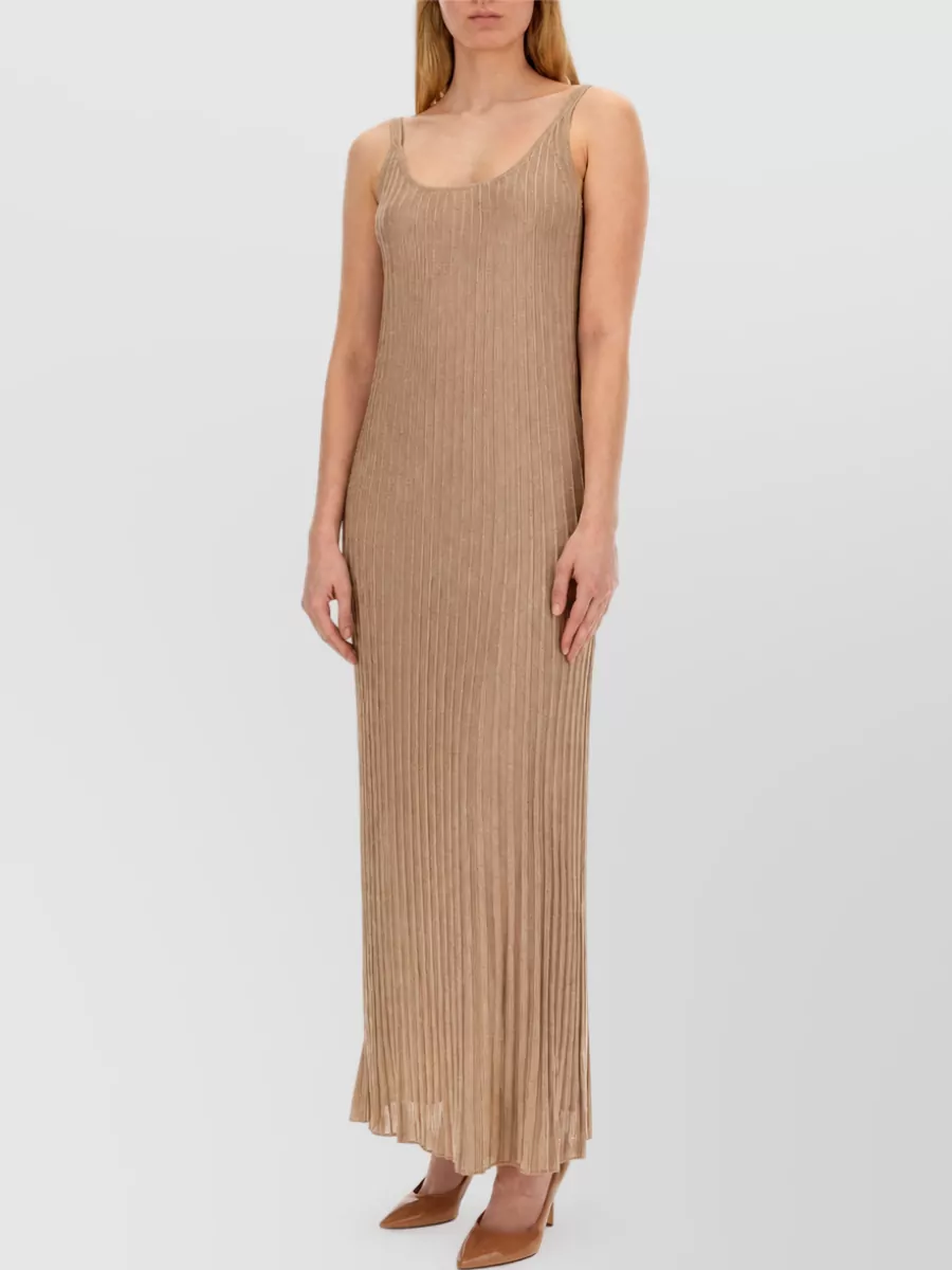 Max Mara Maxi dress — The camel ribbed maxi dress echoes the coat’s quiet luxury and elongated line while keeping the palette warm and harmonious, unlike the crisper white or brighter yellow options.