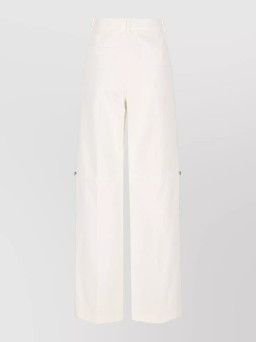 Fendi Cotton high-rise wide-leg trousers — The high-rise ivory wide-leg trouser delivers the clean, tailored column the knit is made for, matching the quiet-luxury tone and soft neutrals while keeping the outfit office-ready.