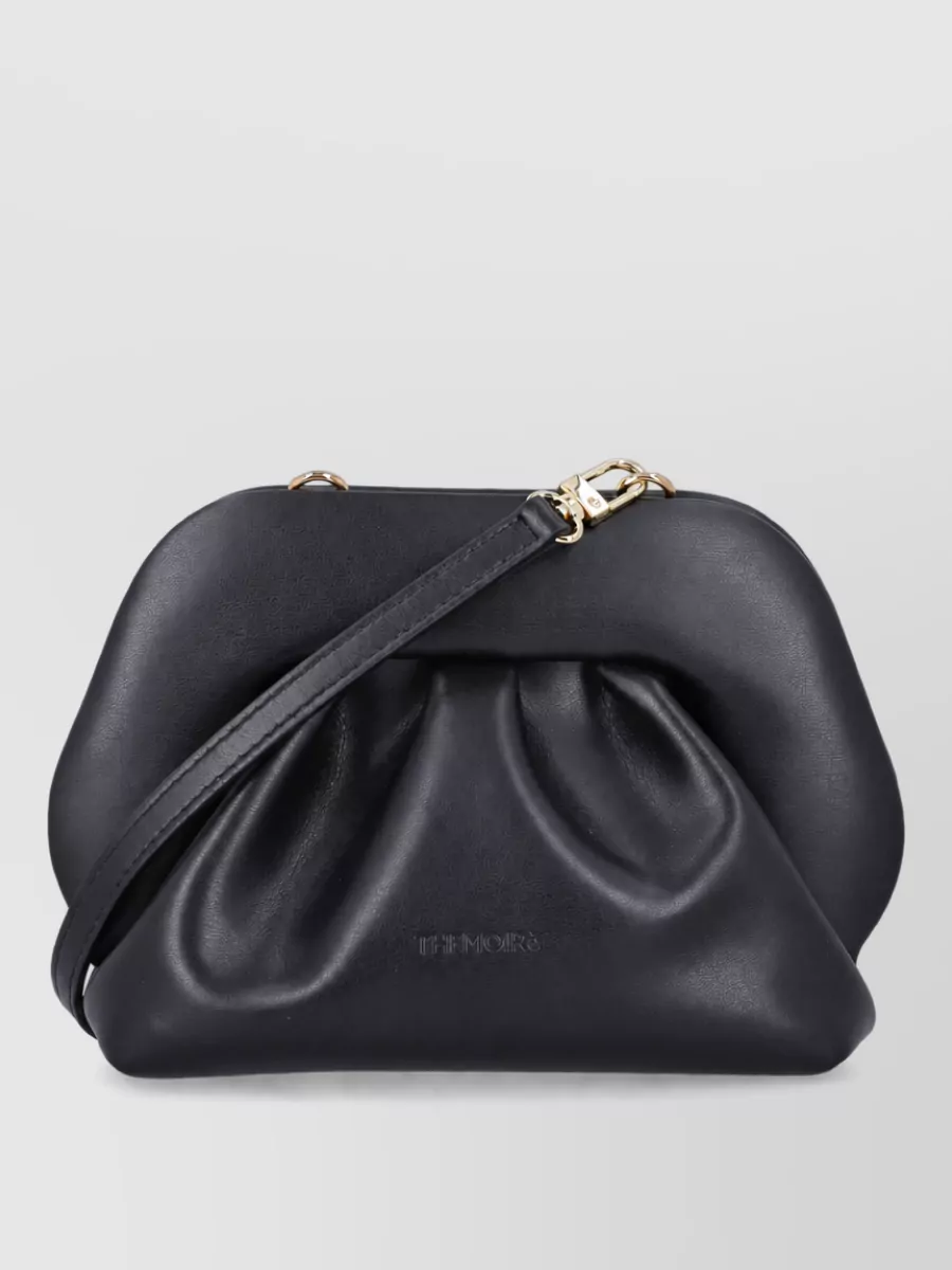 Themoiré bios small clutch bag — The matte black Themoiré pleated clutch quietly echoes the pleat story and structured softness of the cape and dress while keeping the palette deep and unified.