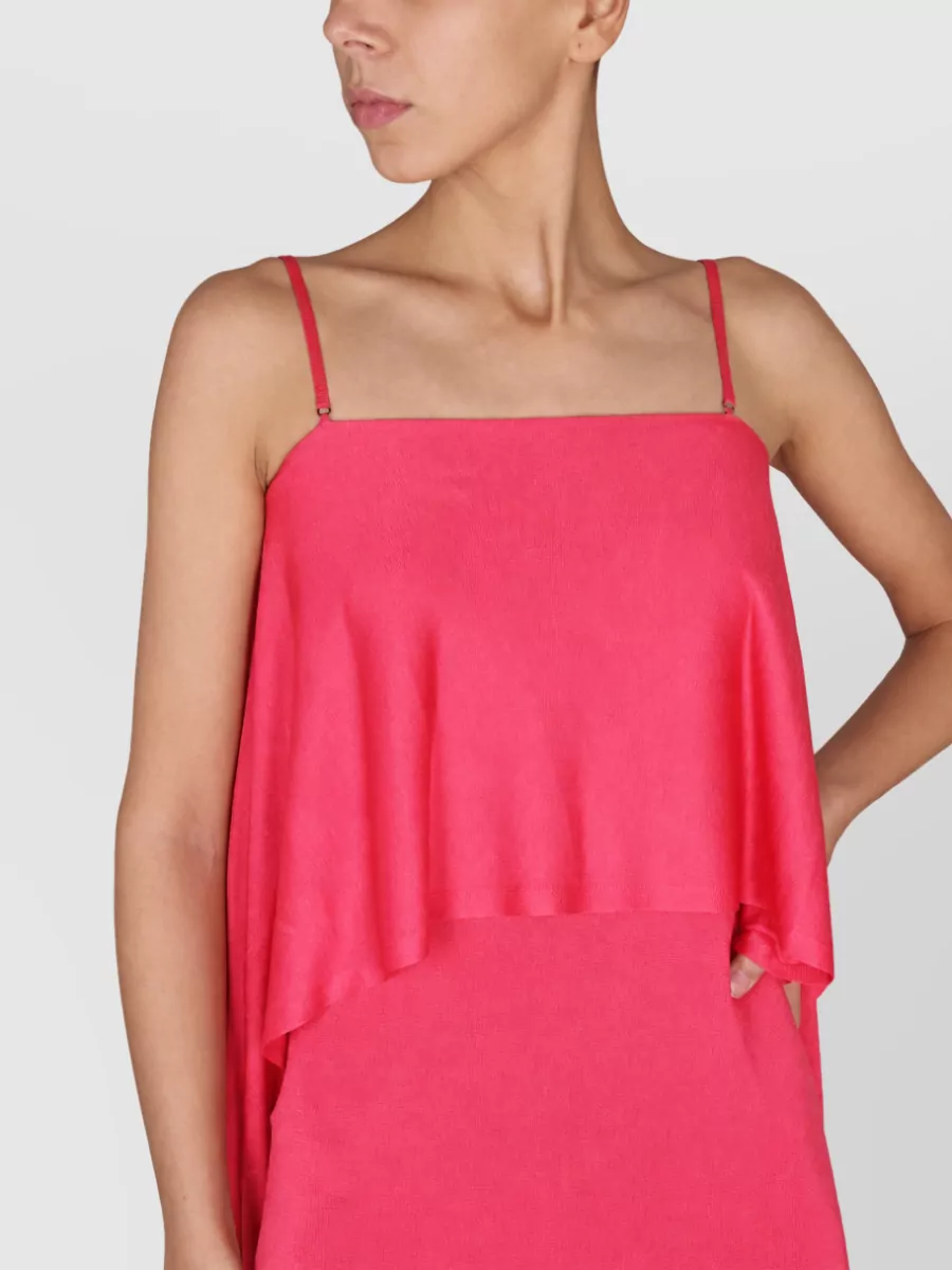 Tom Ford Ruffled maxi dress — The vivid pink column dress closely matches the saturation and attitude of the Tom Ford blazer, creating a sharp tonal pairing ideal for formal evening.