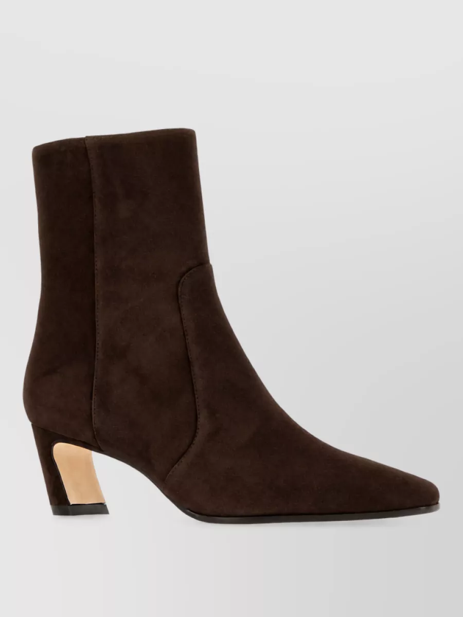 Stuart Weitzman Suede leather ankle boots — The dark chocolate Stuart Weitzman ankle boots give a sharp but walkable finish that complements the refined knit dress and anchors the beige coat without adding visual noise.