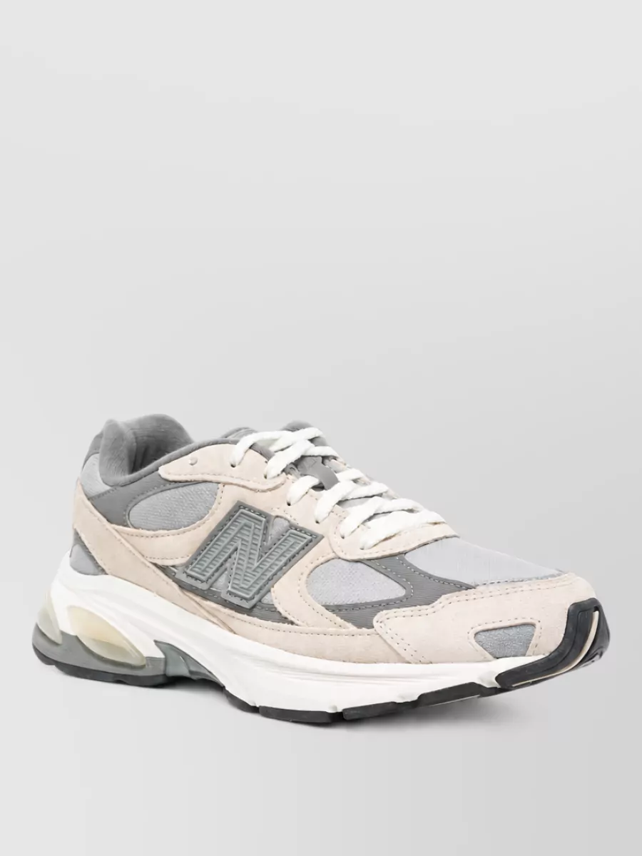 New Balance paneled low-top sneakers