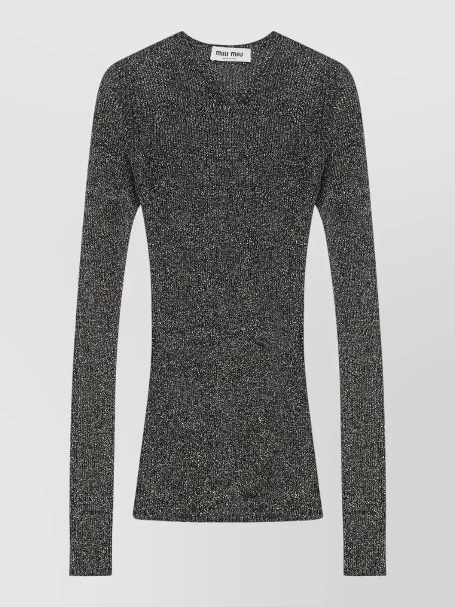 Miu Miu Knitted top — The charcoal metallic ribbed knit tucks cleanly into the voluminous stone mini, echoing its nightlife energy while keeping the upper body sleek and fitted for balance.