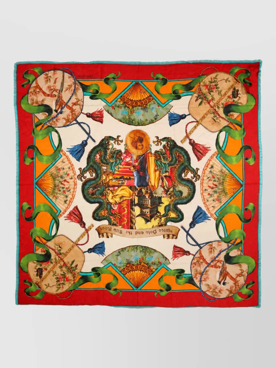 Dolce&Gabbana Cashmere modal shawl scarf — The Dolce&Gabbana scarf quietly repeats the dress’s fiery red and teal tones and can be tied to the bag for a cohesive, romantic color story.