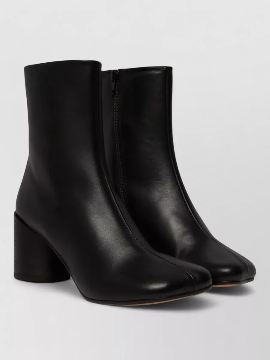 Mm6 Maison Margiela Leather ankle boots — Aeyde’s sleek black ankle boot introduces a grounded, tailored note that sharpens the knit-on-knit softness while staying minimal and versatile for day-to-evening wear.