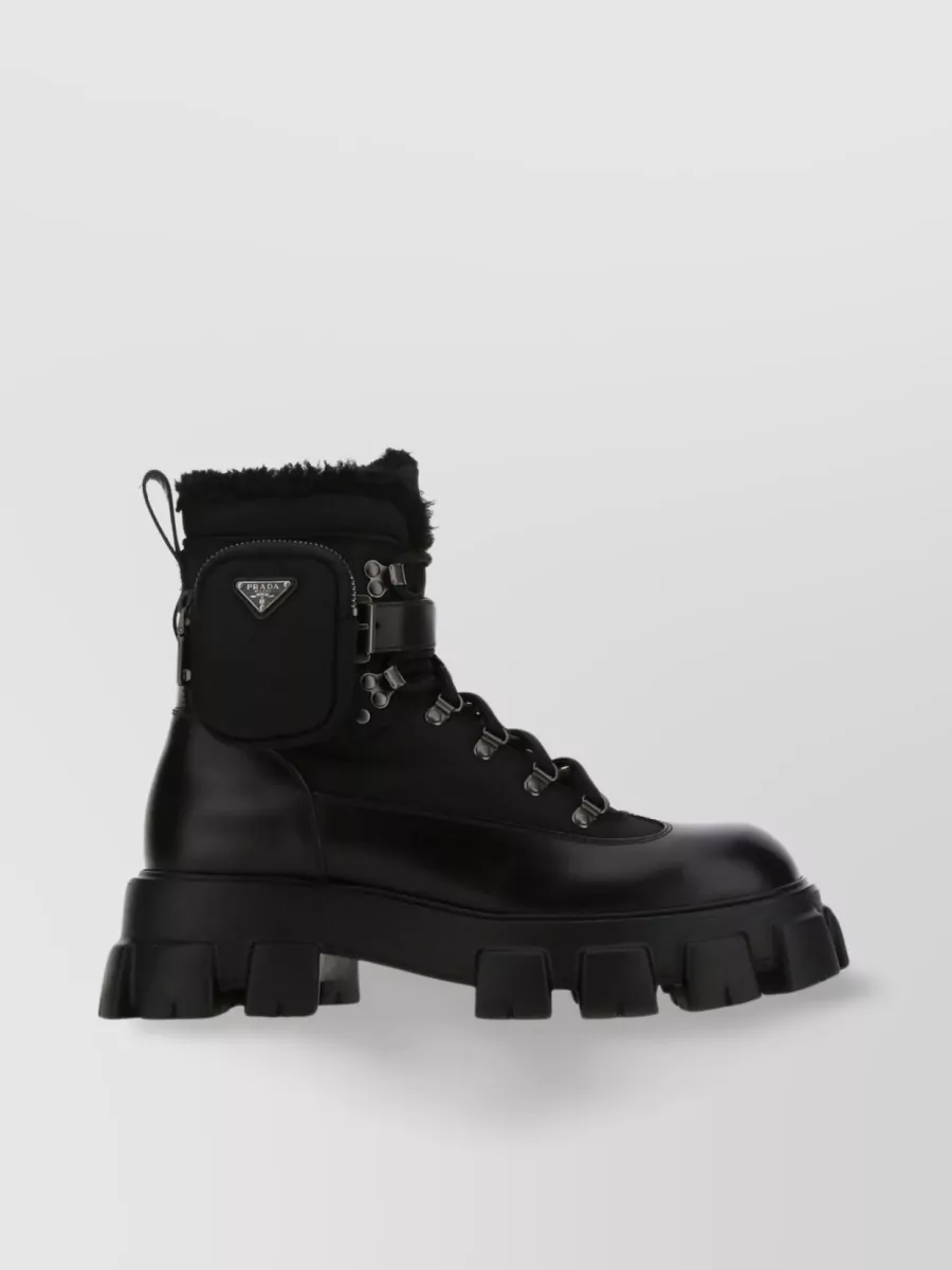 PRADA MONOLITH ANKLE BOOTS WITH FUR TRIM AND LUG SOLE