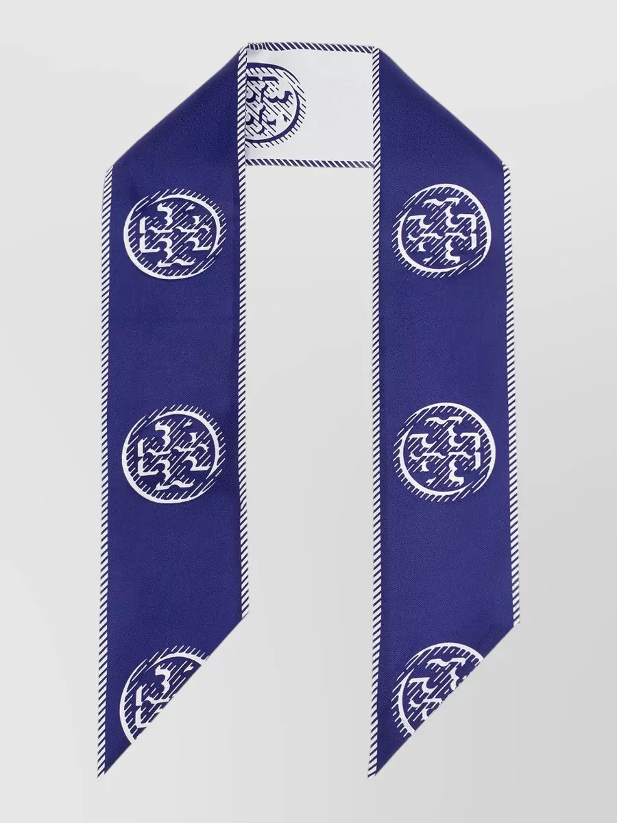 Tory Burch Silk logo-print asymmetric scarf — The navy and white Tory Burch silk twilly repeats the stripe story and colours in a subtle way, adding a preppy accent at the neck or bag handle without cluttering the clean lines.