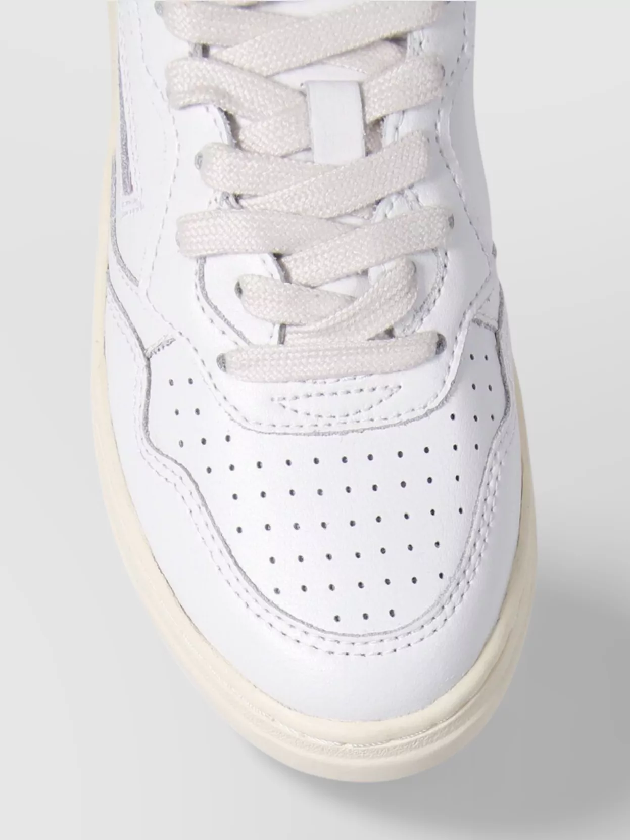 Autry Low Top Rubber Sole Sneaker With Perforated Detailing In White