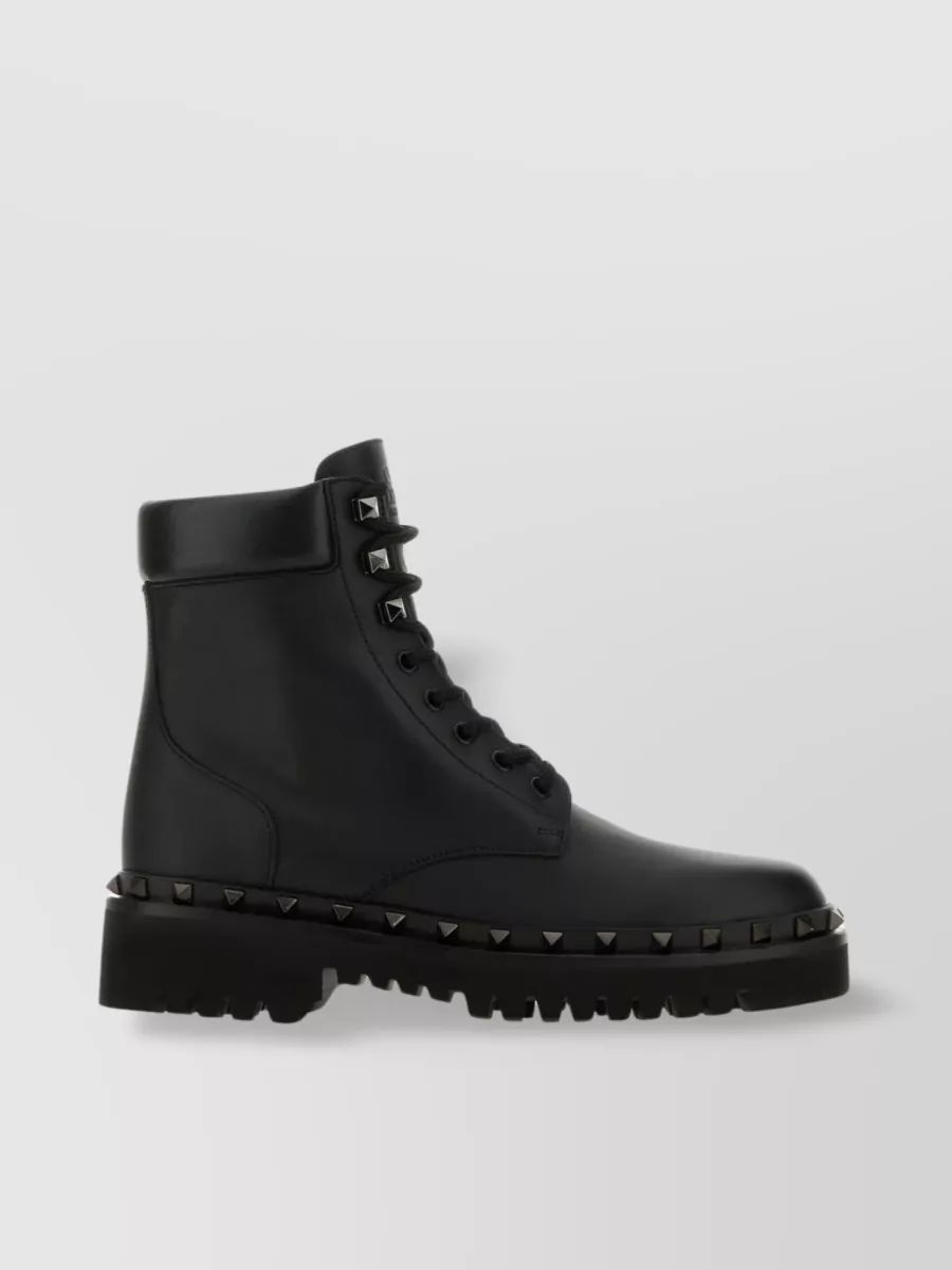 Shop Valentino Studded Lug Sole Ankle Boots In Black