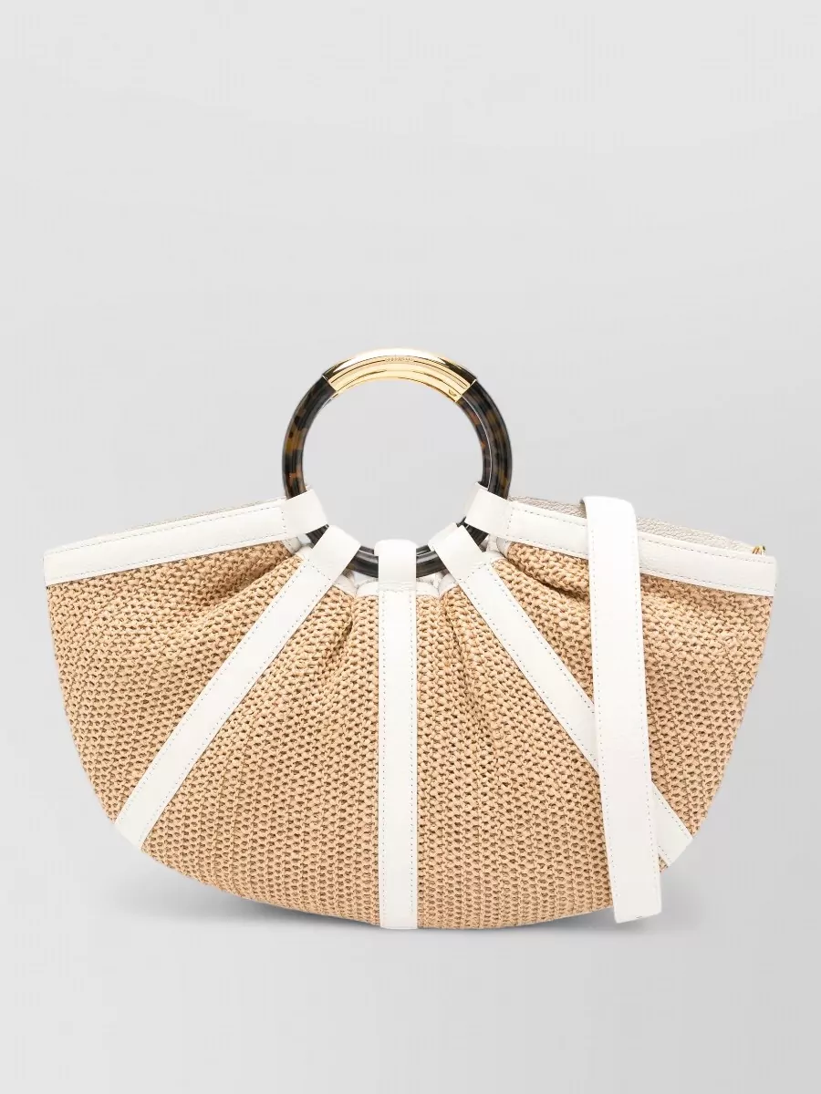 Coccinelle Straw beach bag — The Coccinelle raffia-and-white fan tote leans into the beachy, sheer mood of the skirt, echoing the white of the shirt and sandals while staying polished enough for a seaside lunch.