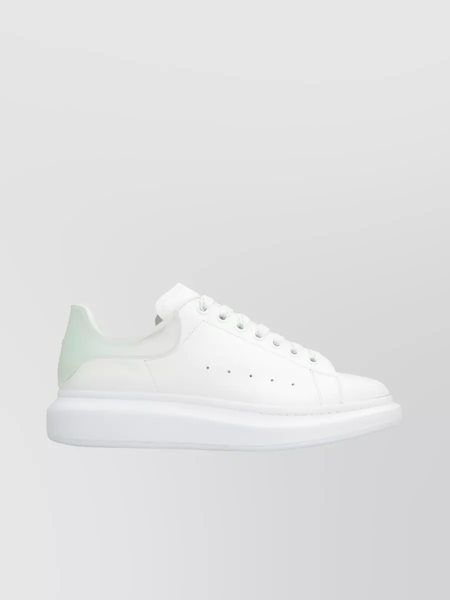 Shop Alexander Mcqueen Sleek Low-top Leather Sneakers In White