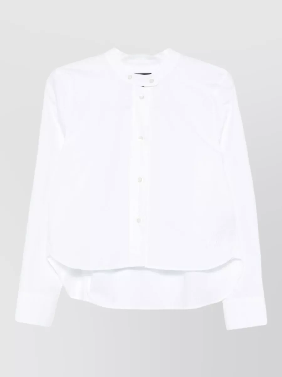 Emporio Armani Cotton long-sleeve shirt — The satin ivory-grey tee-blouse keeps the palette soft around the dove-grey trouser and maintains a light, fluid, office-ready balance without adding another strong tailoring layer on top.