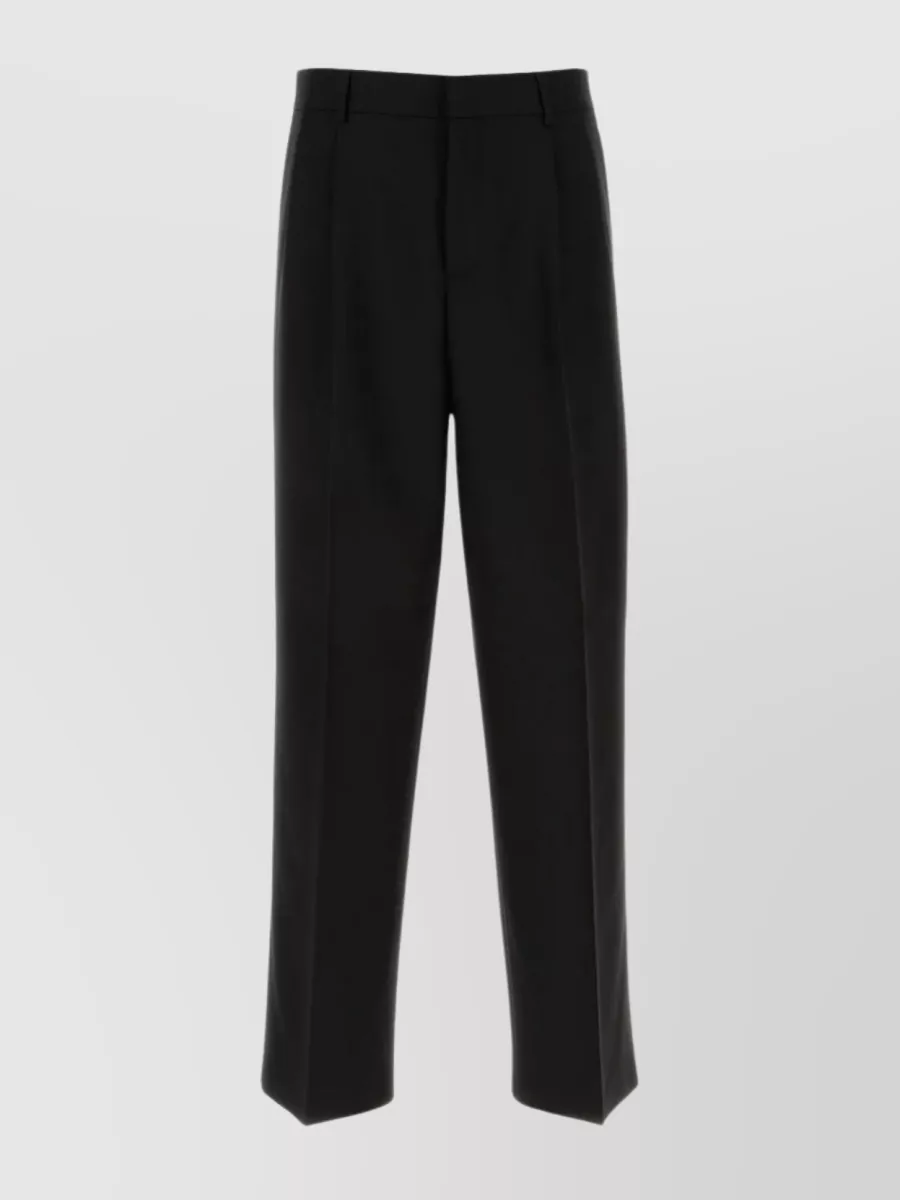 Shop Versace Pleated Straight Leg Wool Trousers In Black