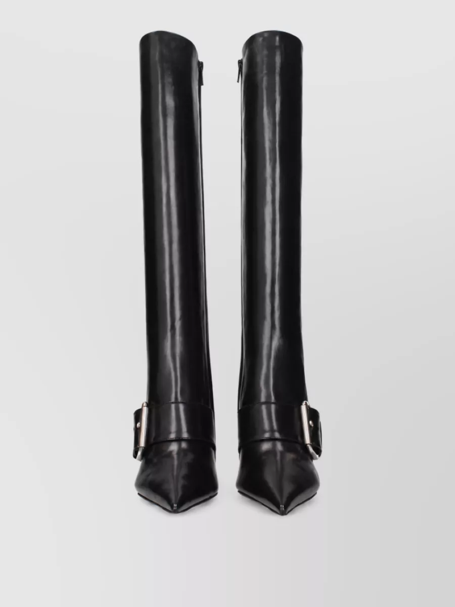 Balenciaga Leather ankle boots — The black knee-high Balenciaga boots echo the styling reference, keep the leg sleek under the mini length, and balance the neon dress with a darker, club-ready edge.
