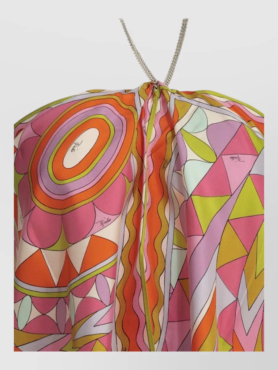 Pucci Silk halterneck blouse — The draped halter in the same bubblegum‑orange‑lime Pucci palette mirrors the shorts’ print without competing, and the fluid halter cut balances the fitted micro silhouette for a polished, party‑ready set feel.