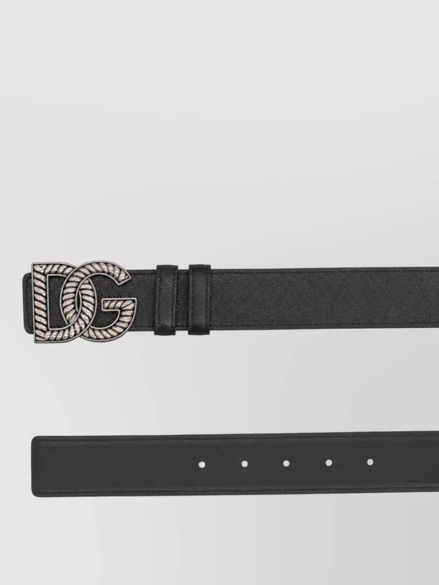 Dolce&Gabbana Leather belt — The navy belt quietly defines the waist and harmonises with the tee and sneaker accents, adding structure without interrupting the soft blue palette of the jeans.
