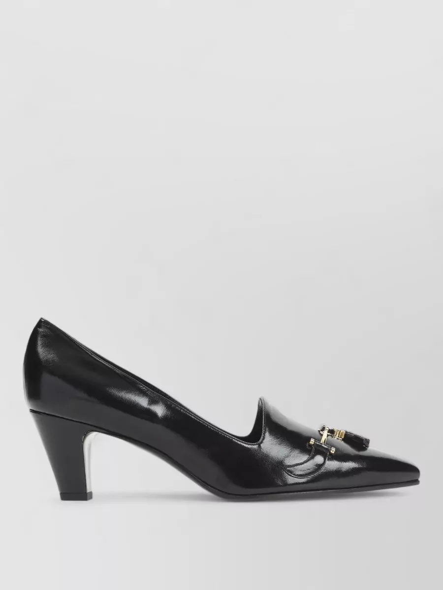 Celine Leather pumps — Celine’s black loafer pump matches the shirt’s formality and brand tier, grounding the light palette with a precise, boardroom-ready finish.