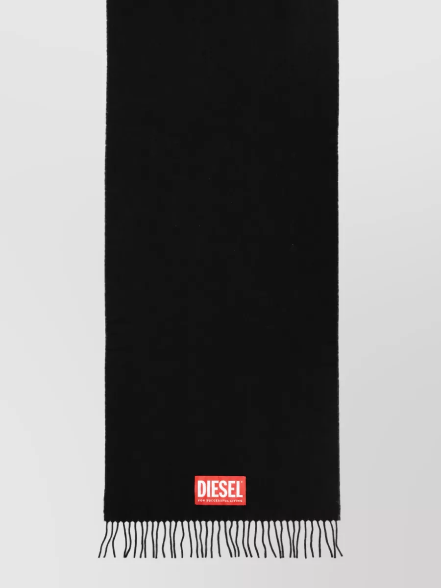 Diesel Wool scarf — The black Diesel scarf with a small red logo patch quietly ties back to the tee’s red chest logo and adds a functional winter layer without breaking the sport-street mood.