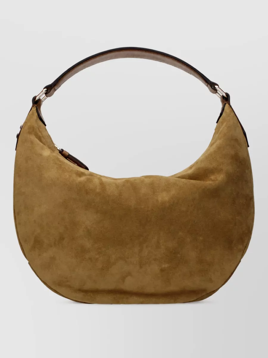 Jimmy Choo Suede leather shoulder bag — The Jimmy Choo camel suede hobo mirrors the sneaker’s suede and earthy tone, reinforcing the relaxed streetwear feel while staying within a refined luxury bracket.