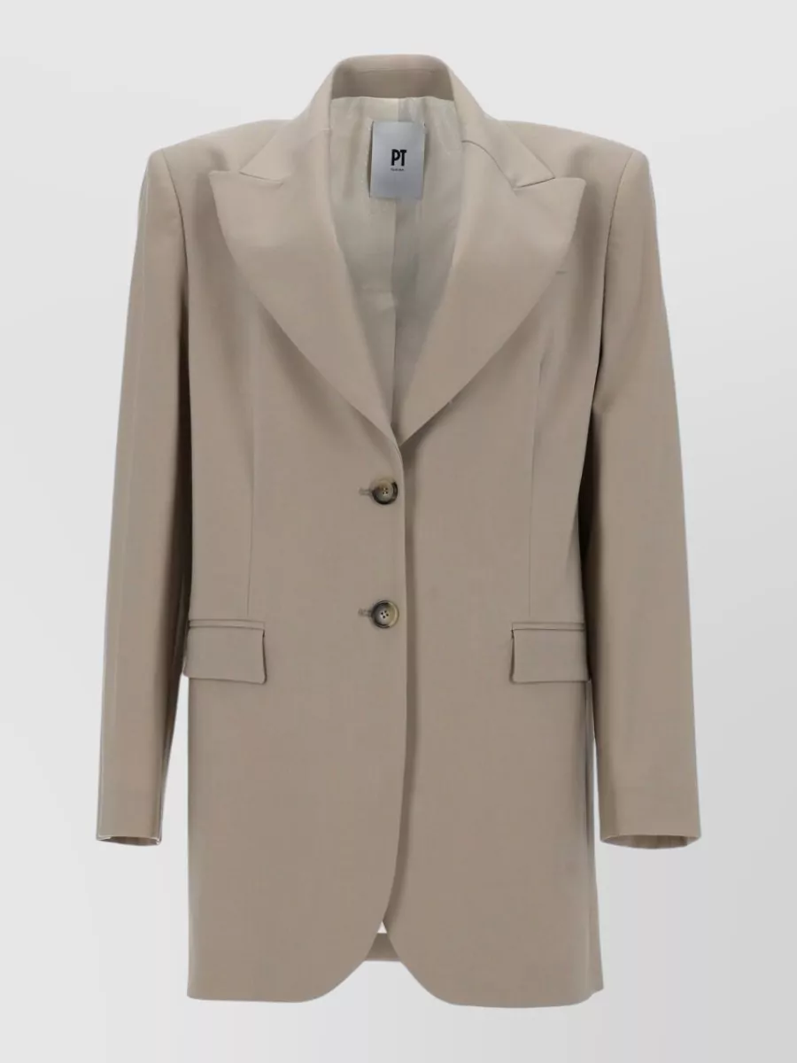 Pt Torino Wool suit jacket — The dusty slate-blue Blazé Milano blazer delivers longline Italian tailoring that contrasts beautifully with the light beige trousers while staying in the same minimalist, quiet luxury universe.