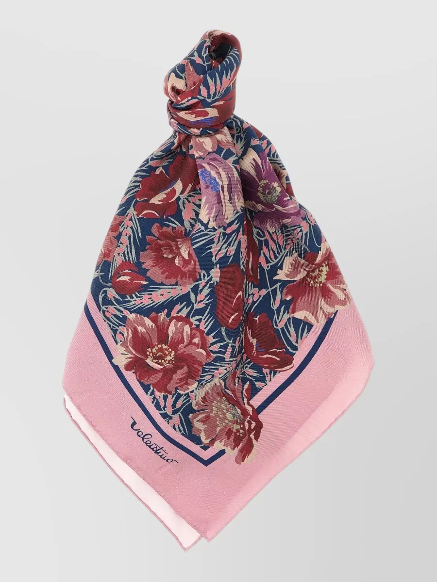 Valentino Garavani Silk printed scarf — The floral pink-and-navy scarf introduces a romantic accent you can knot at the neck or bag handle, tying together the soft pinks while adding just a hint of contrast.