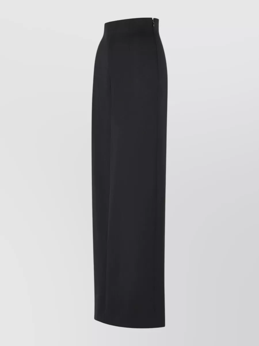 Maison Margiela Virgin wool high-rise wide-leg maxi trouser skirt — The ink-black mid-rise wide-leg trouser mirrors the shirt’s androgynous precision and creates a long, architectural column that suits the minimalist, quiet-luxury brief for cool-weather tailoring.