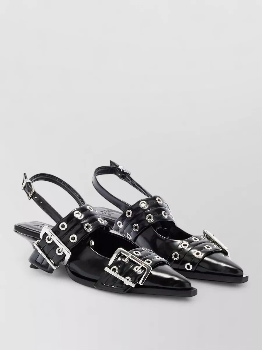 Ganni Pointed-toe buckle pumps — The black kitten-heel slingbacks with grommet straps bring the same downtown, slightly punk attitude as the blazer, add a bit of height, and keep the palette clean and polished for evening.