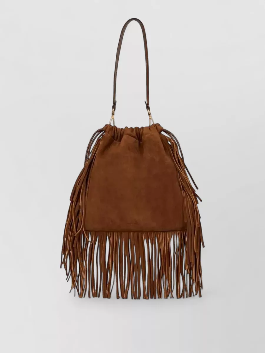 Etro Na leather studded fringed bucket bag — The Etro tan suede fringe bucket leans into the dress’s boho paisley story and warm rust tones, adding luxurious movement without clashing with the metallic detailing.