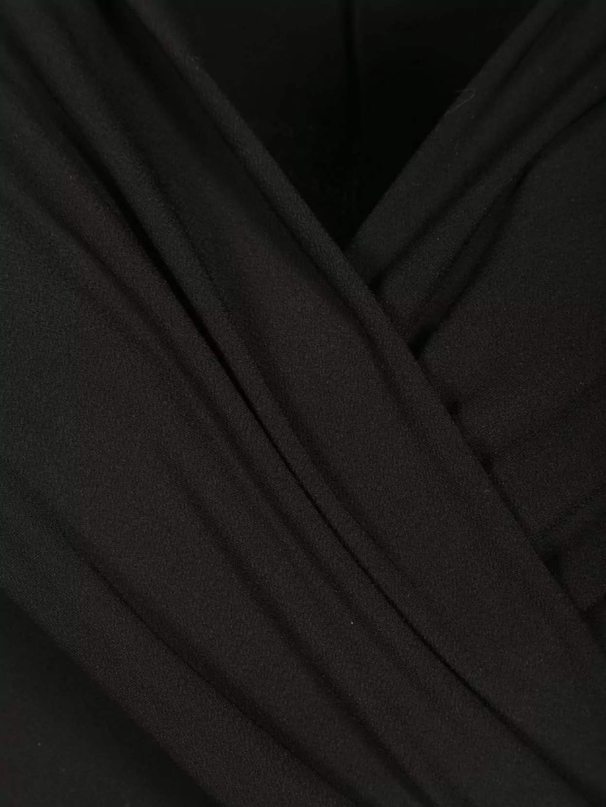 The Andamane Draped Neckline Sleeveless Flared Leg Jumpsuit