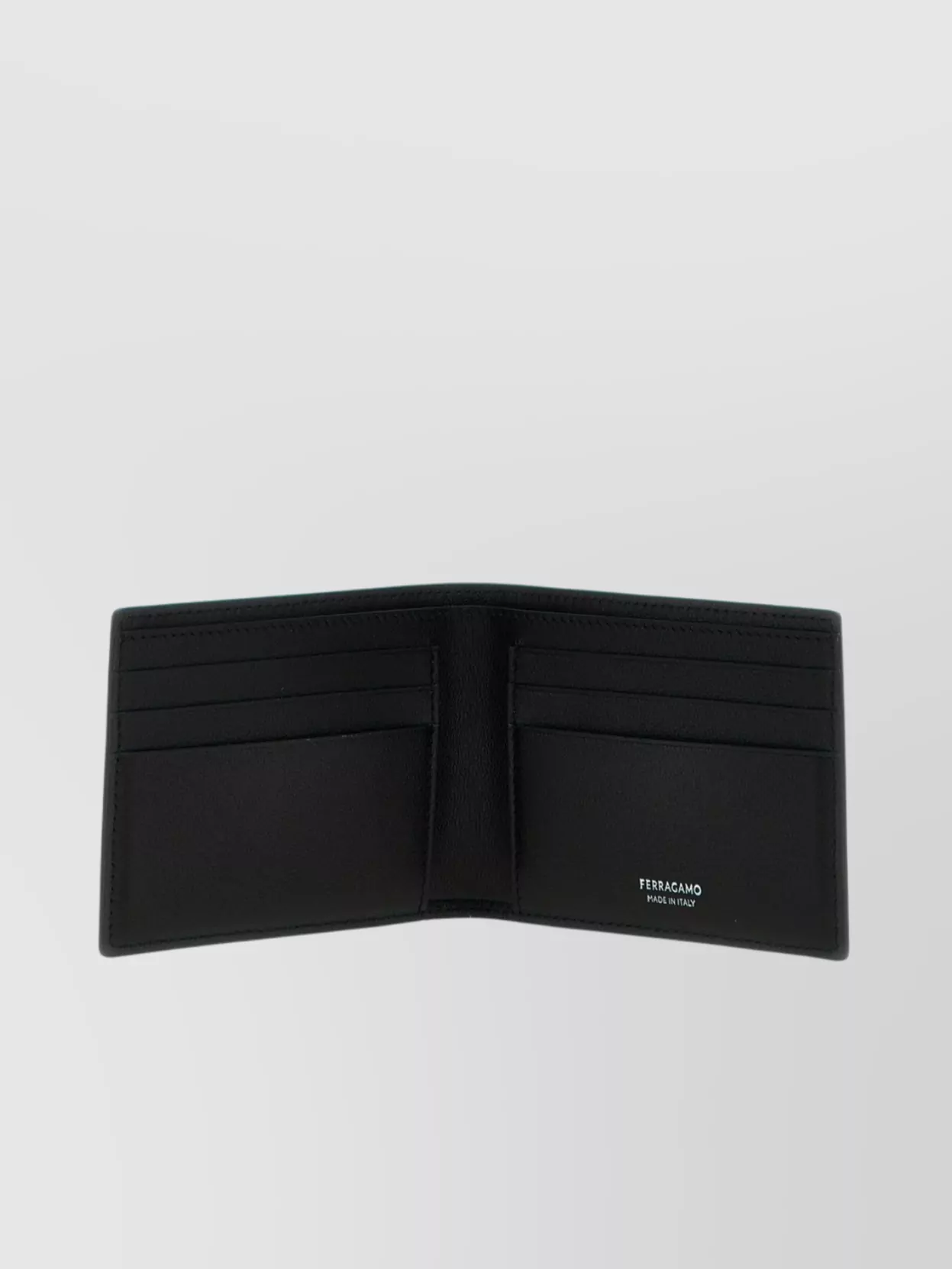 Ferragamo Logo Patterned Bi-fold Wallet In Black