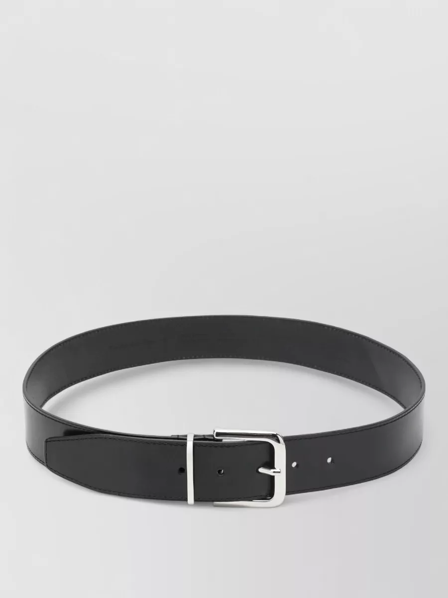 The Frankie Shop Leather belt — The slim Max Mara belt offers the option to subtly define the waist over the dress without visual noise, keeping with the minimalist, tailored sensibility.