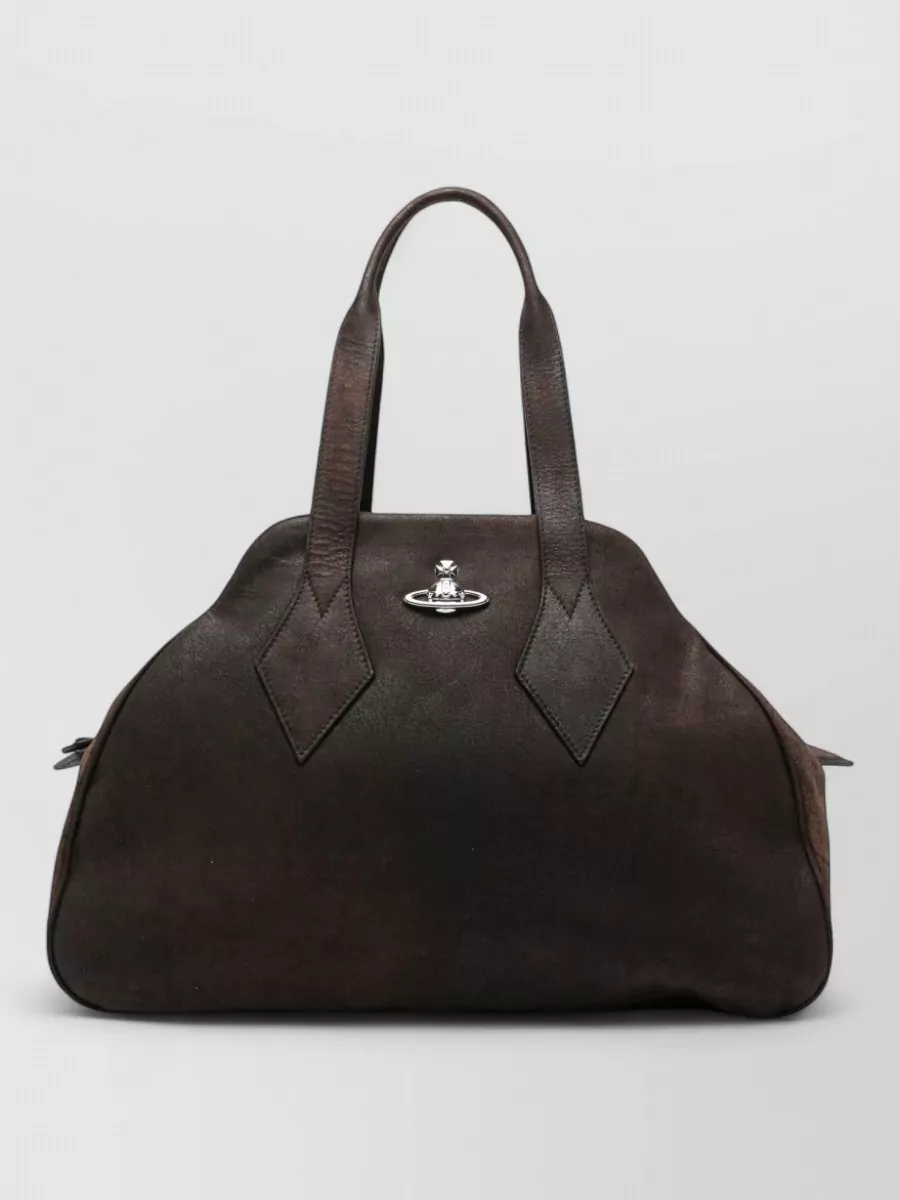 Vivienne Westwood Shoulder lamb leather shoulder bag — The dark chocolate Vivienne Westwood top-handle harmonises with the brown accents in the trousers and loafers while staying structured enough for a polished workday edit.