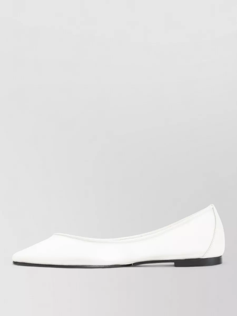 Jacquemus Mesh ballerina shoes — The Valentino nude-blush flat strappy sandal keeps the look romantic and elevated enough for cocktail-hour while staying light, tonal, and in harmony with the dress’s sand hue.