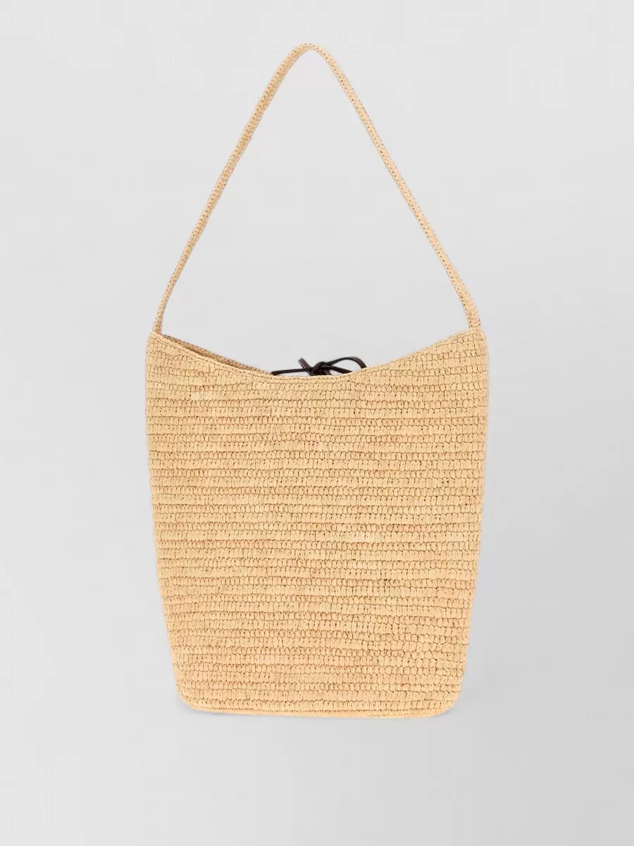 The Row raffia beach bag