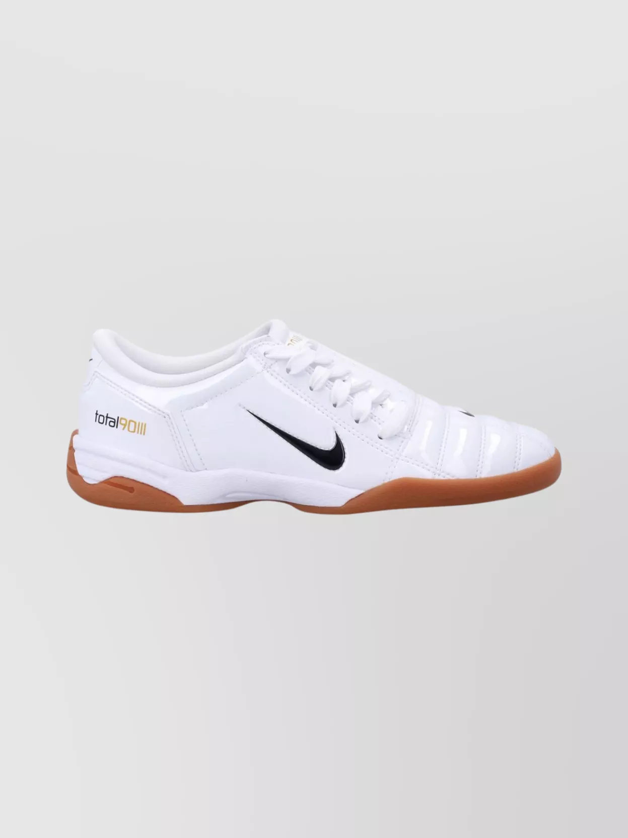 Nike Synthetic low-top sneakers — The white and gum Nike low-tops add a fresh, classic sport finish that lightens the navy set and works for both gym sessions and off-duty wear.