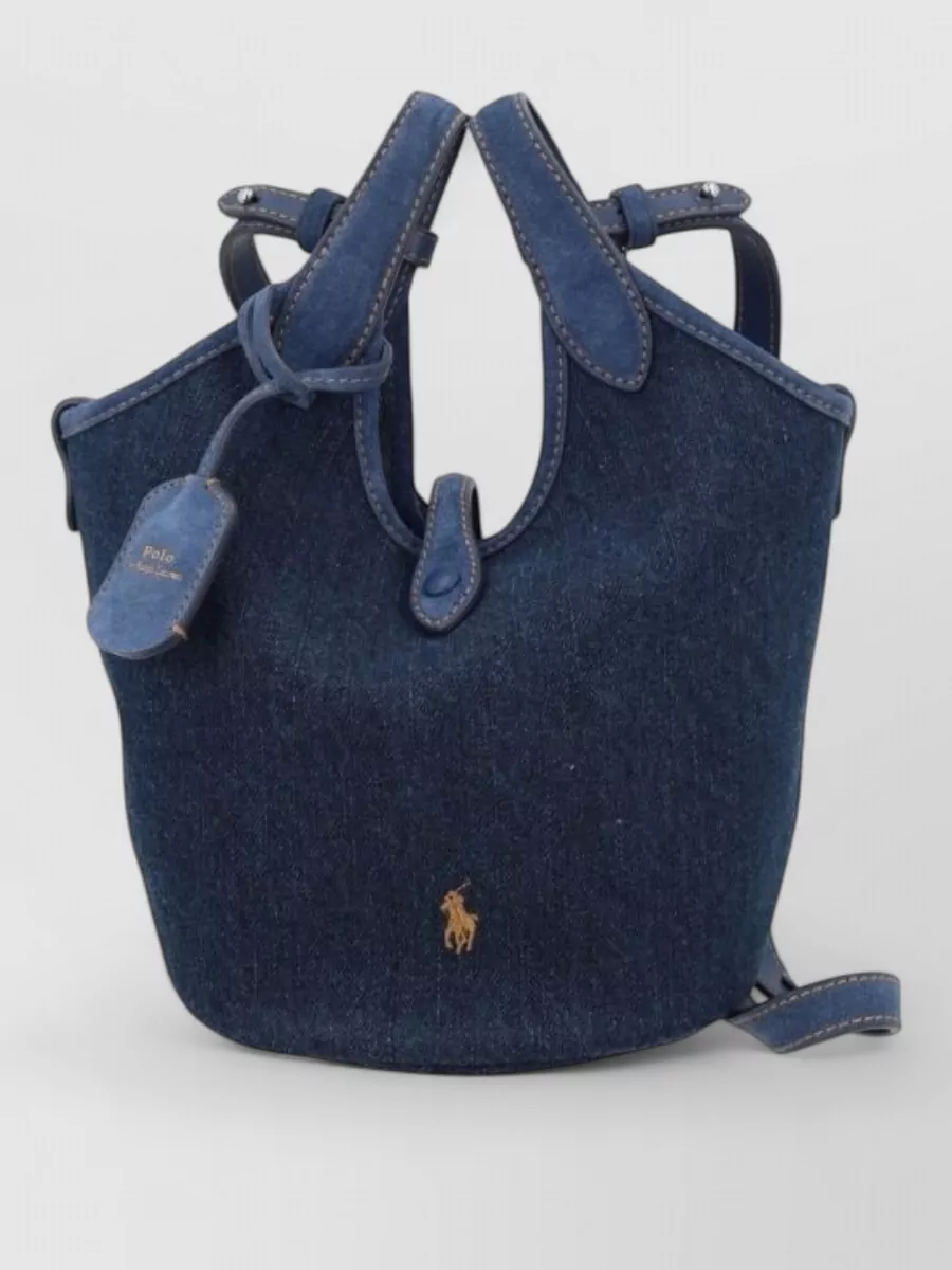 Polo Ralph Lauren Denim small bucket bag — The sand-and-navy Polo tote locks in the collegiate color story and brand language, reading practical yet polished against the hoodie and track pant.