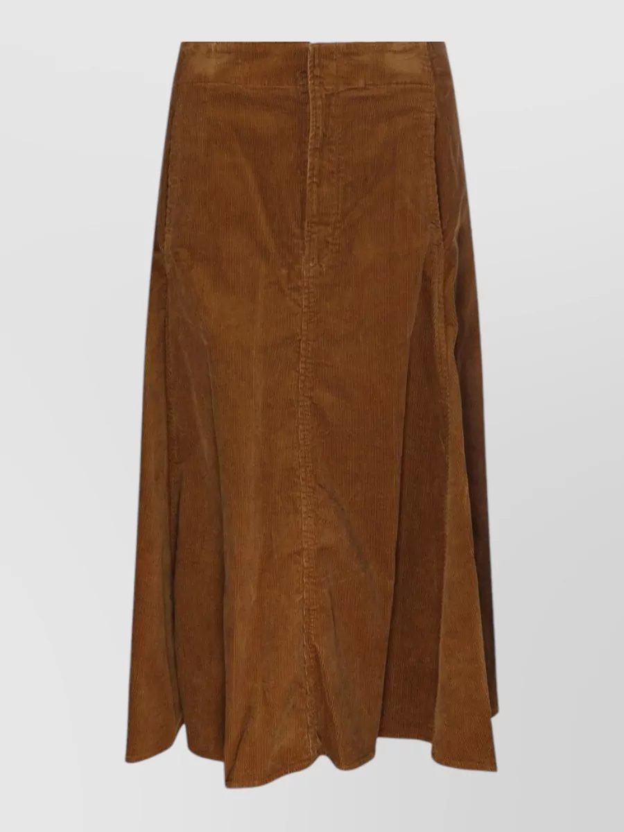 Ralph Lauren A-line skirt — The caramel corduroy midi skirt mirrors the sweater’s quiet-preppy mood, keeps the formality smart-casual, and balances the cropped knit with a high waist and fluid A-line.